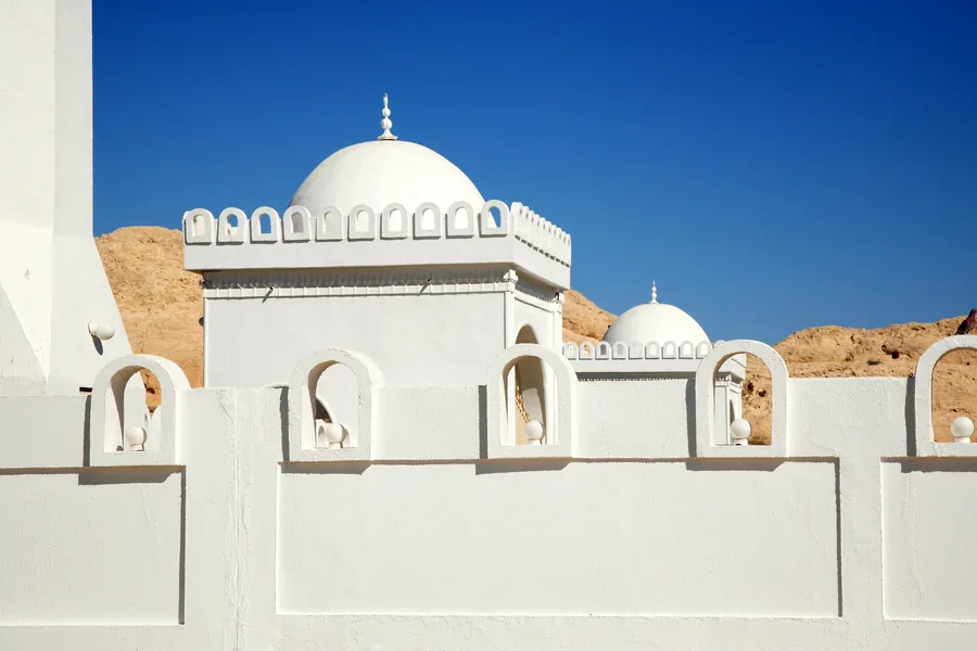 White heritage building with domes in Al Ain