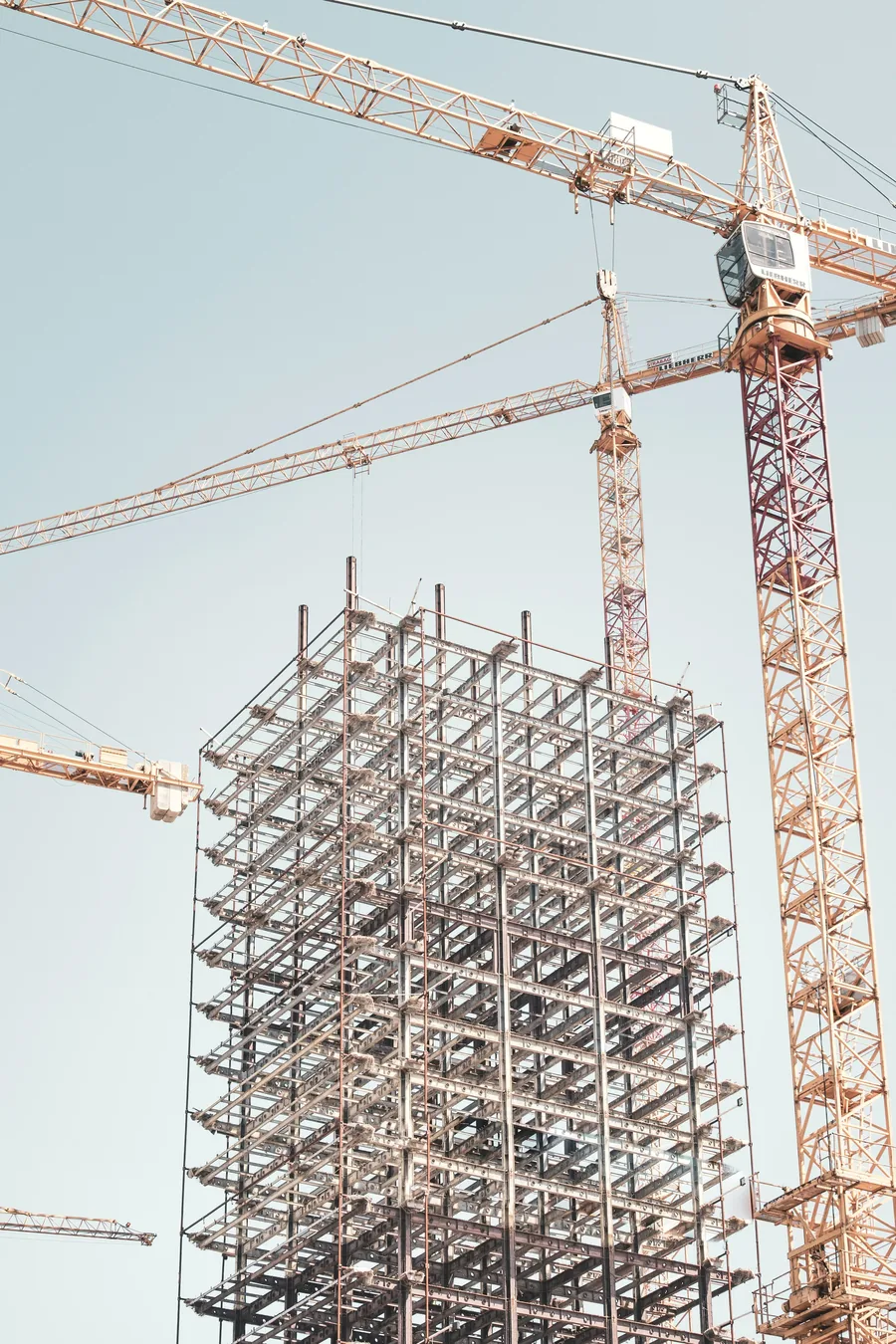 Tower cranes over a building under construction